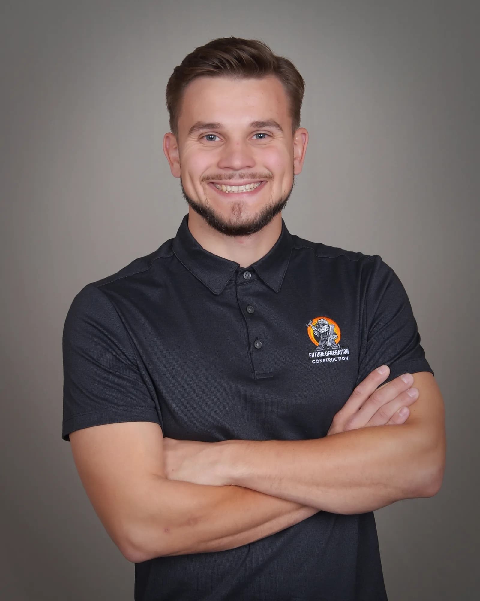Smiling Future Generation Construction team member in a branded polo — Sacramento family-owned remodeler portrait