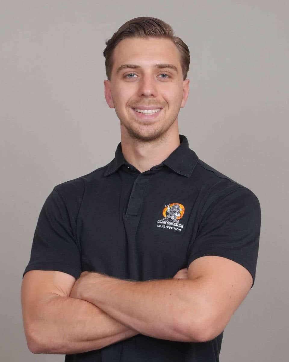 Tim, lead estimator and sales leader, wearing a branded company T-shirt at the Sacramento remodeling office