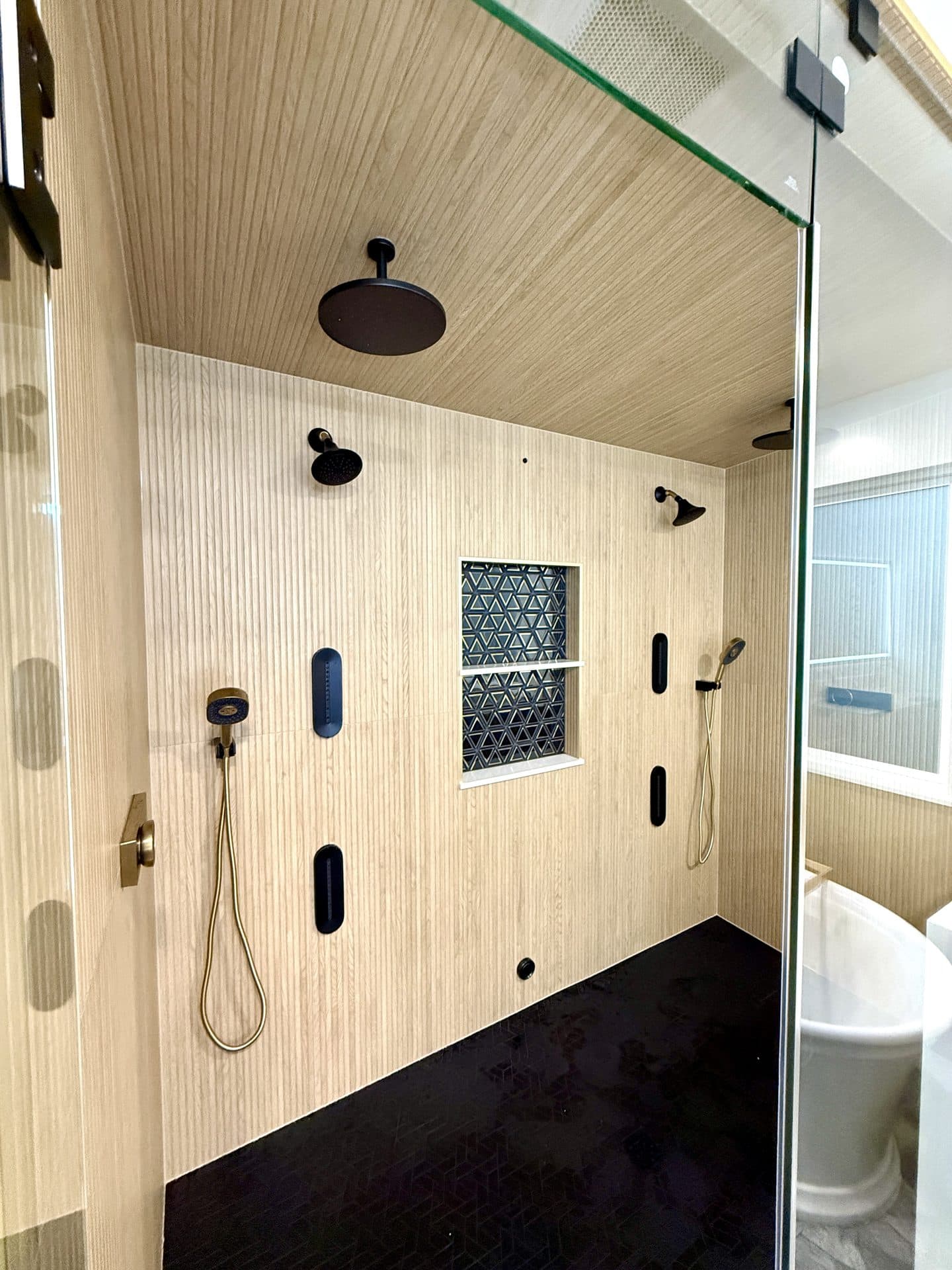 Sacramento bathroom remodel design — walk-in shower with marble-look tile